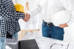 architect finishing negotiating project 300x200 - Types of Construction Contracts: Pros, Cons & Best Practices